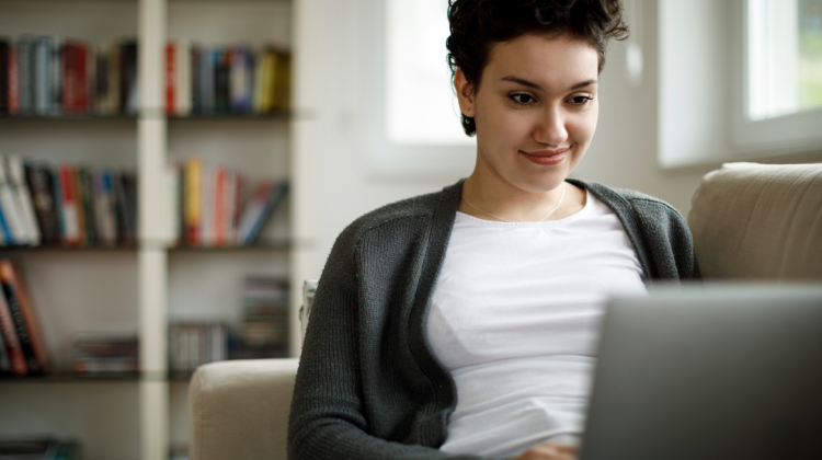 A young lady browsing on the laptop, Internet services powered by Brightspeed.