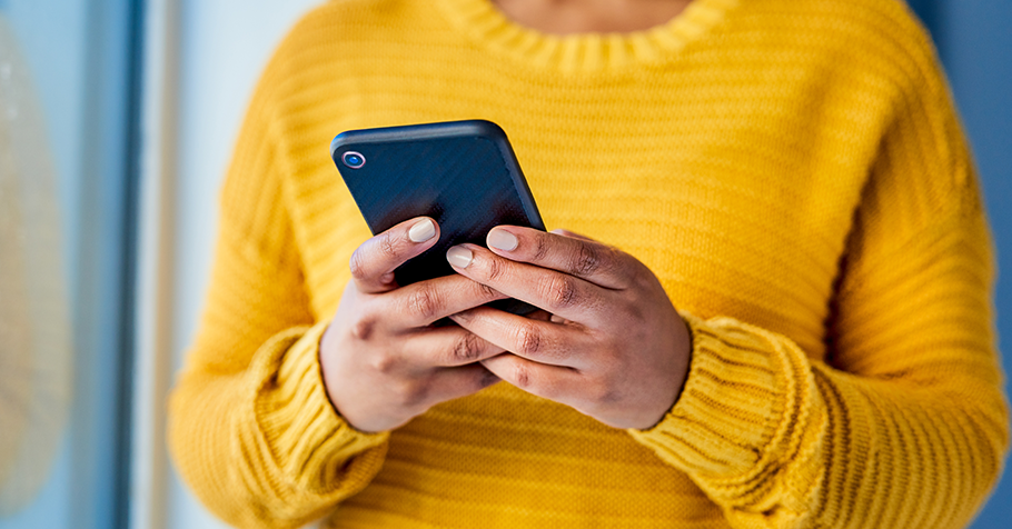 Adult holding a mobile phone